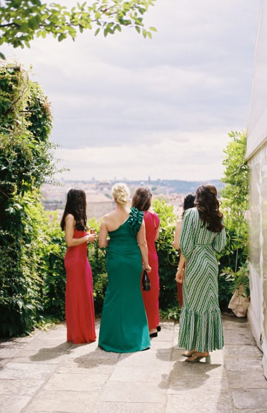 Bridesmaids walking with a city view